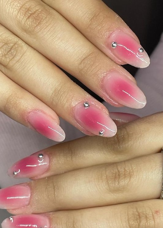 Pink aura nail design with diamonds