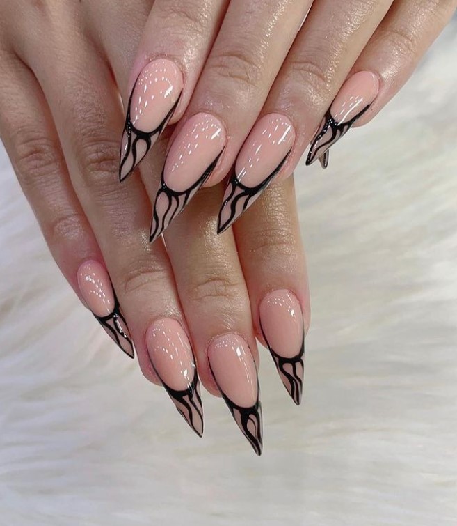 classy black nail ideas: black swirls on tips