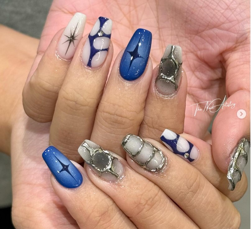 metallic nail art  design with blue hues