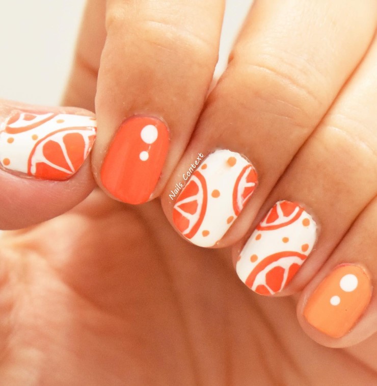 Short Cute Orange Nails with White Colors