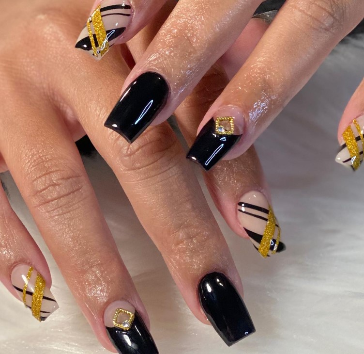 golden paired with black nails