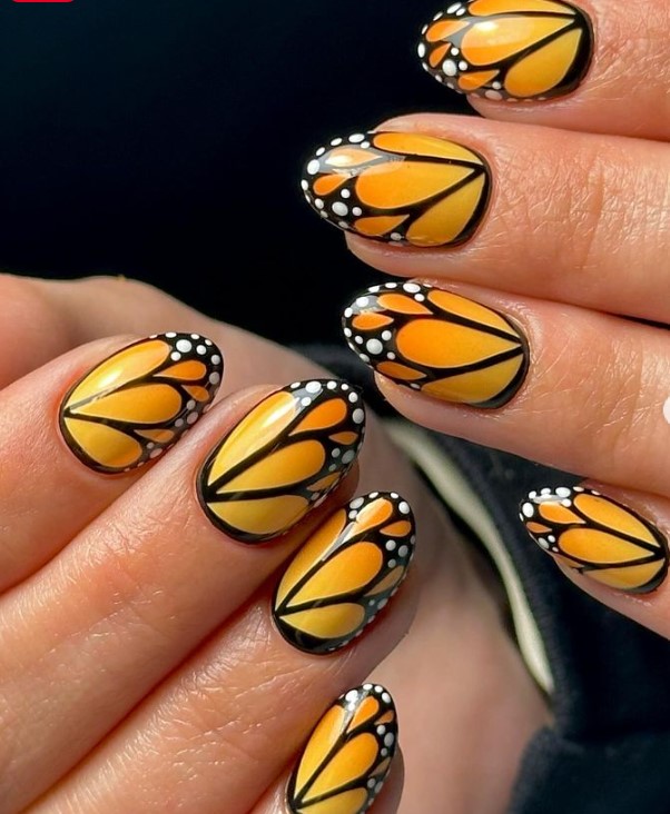 Orange Chrome Nails With Black Daisies