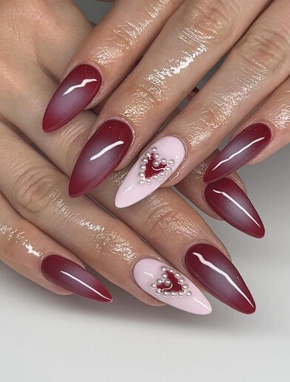 red Aura nails with little pearl hearts