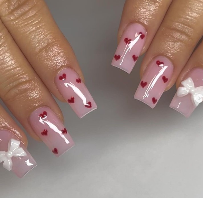 Baby pink nails with red little hearts