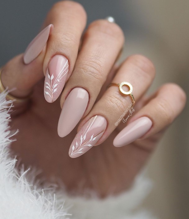 Beige Nails With Subtle Sparkles and Delicate White Leaves