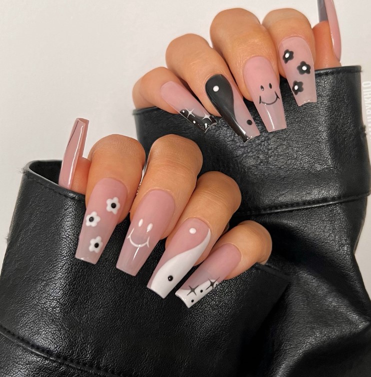 Black and White flowers on Blush Nails