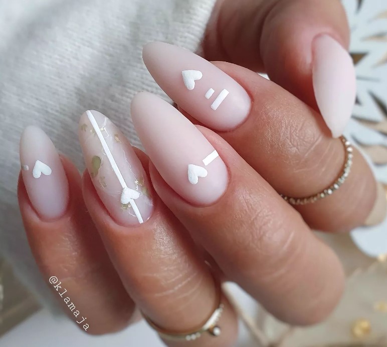 Minimalistic Natural Almond shaped nails with little white hearts