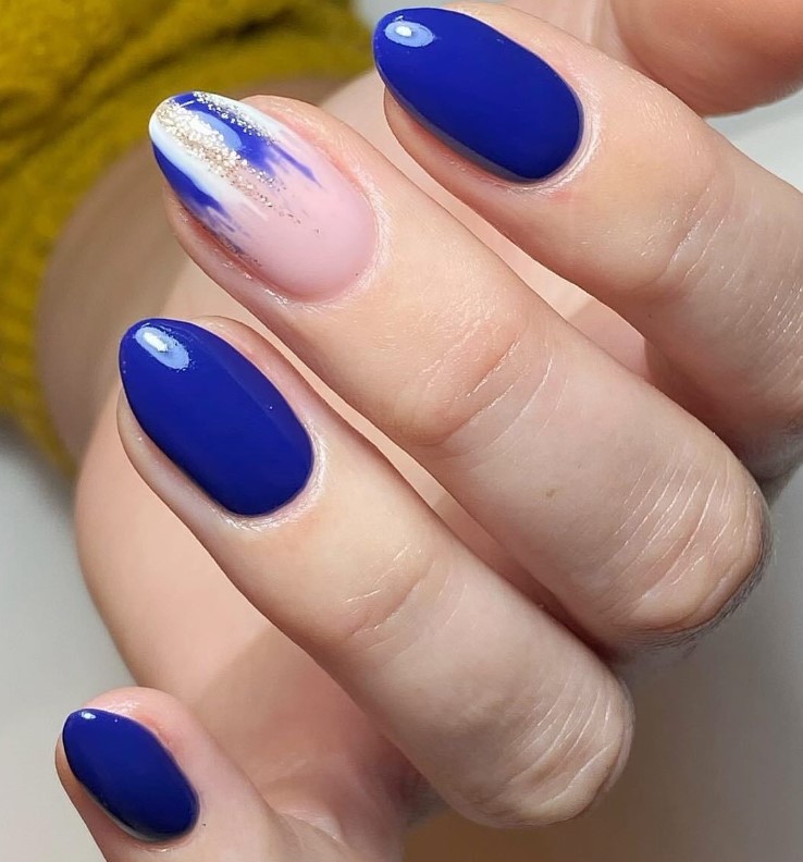 Deep Blue and Glitter Nails