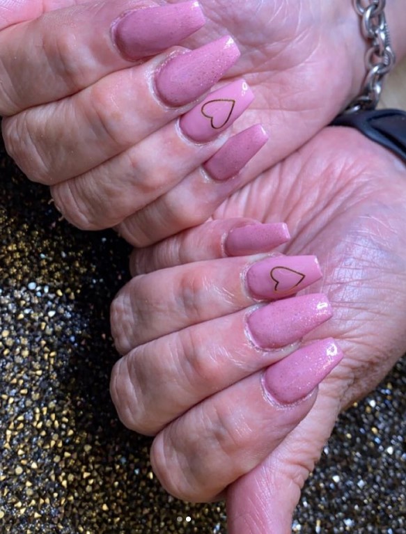 Perfect Pink Coffin Nails with Hearts on ring finger