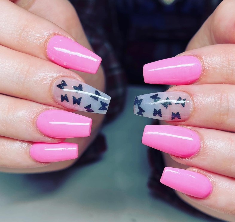 Pink Nails with black butterfly motifs on one natural nail