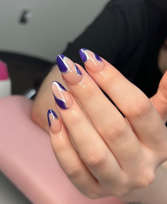 navy blue almond nails with negative spaces