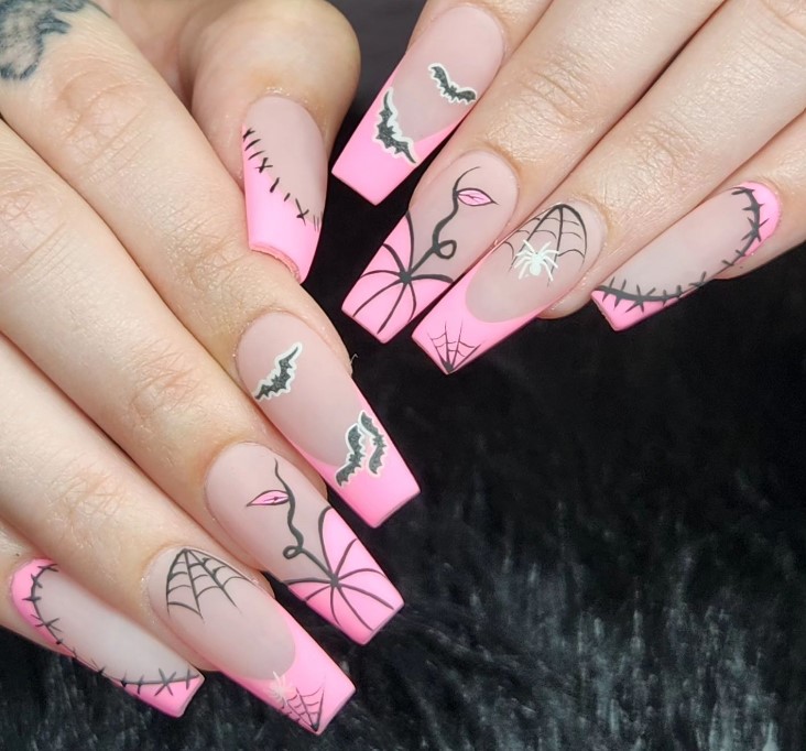 Black an pink nails with white spider