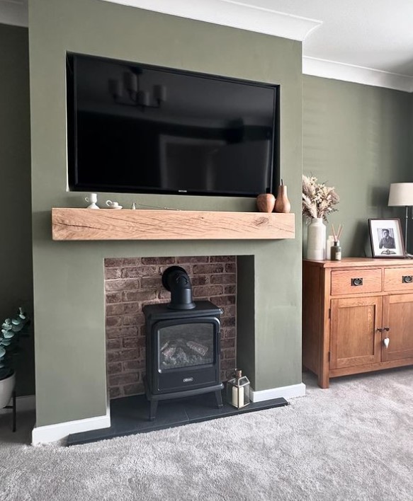 Green Media wall with TV and Fireplace in Living room