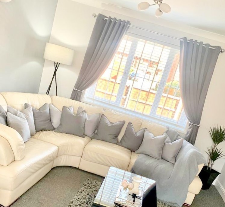 Grey Cushions and Curtains with White Couch