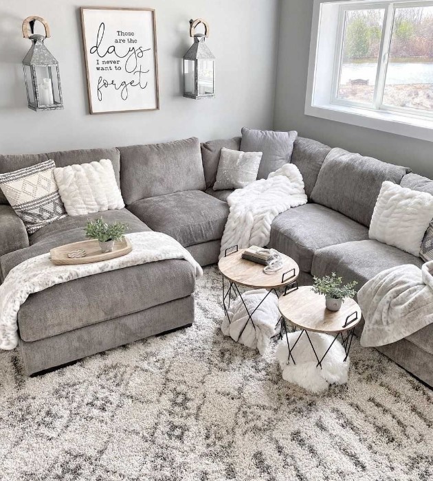 Grey sofa with cozy white throws ans cushions