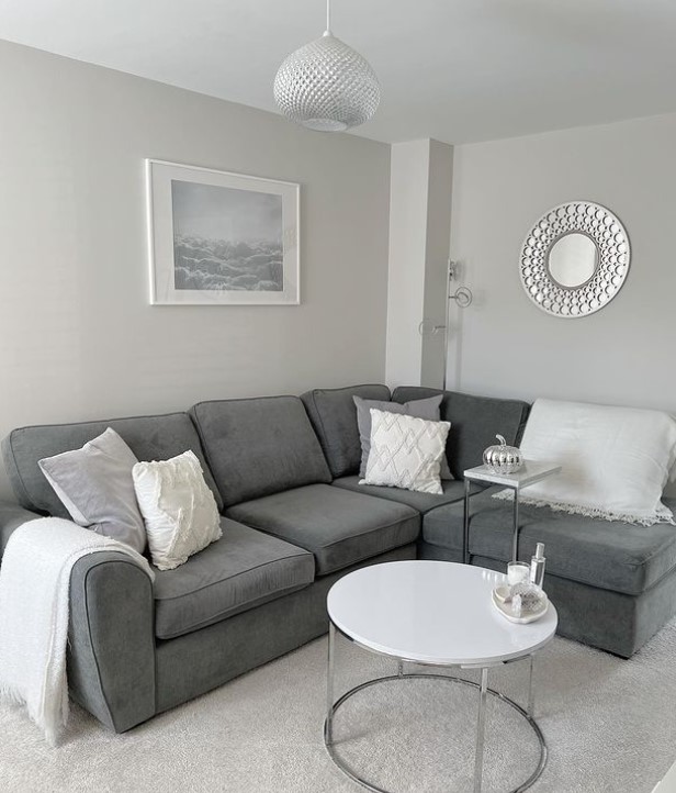 Grey sofas with white cushions