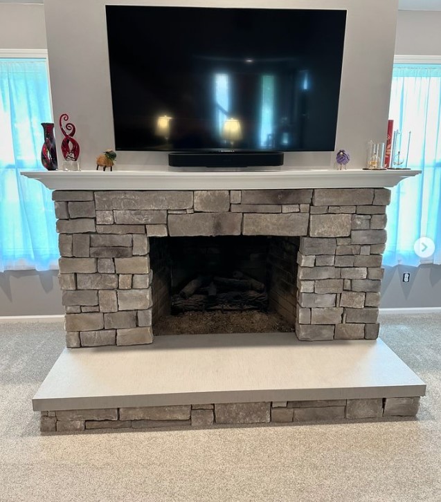 Stonework  Fireplace with Mounted TV