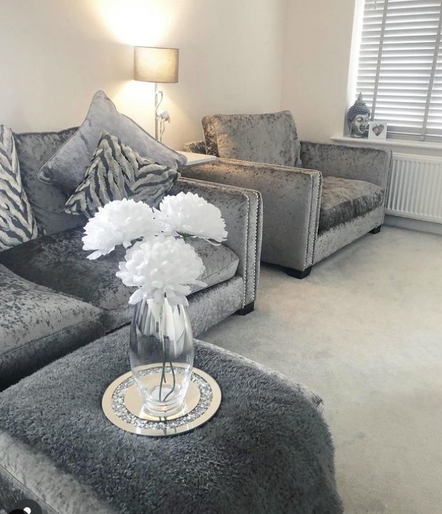 White flowers with grey Sofas and Throw