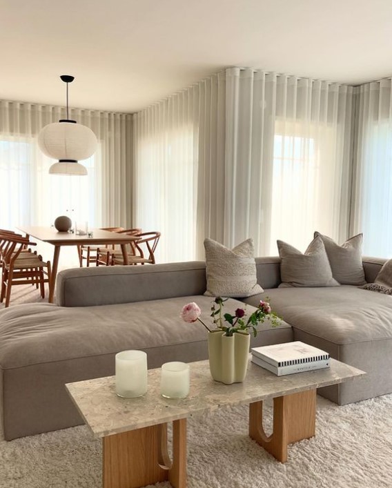 White Curtains and Gray Sofa